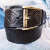 a handmade black leather belt embellished with stamps of motorcycle gear stunning belt for bikers the perfect gift for motorcycle lovers a handmade black leather belt embellished with stamps of motorcycle gear stunning belt for bikers the perfect gift for motorcycle lovers