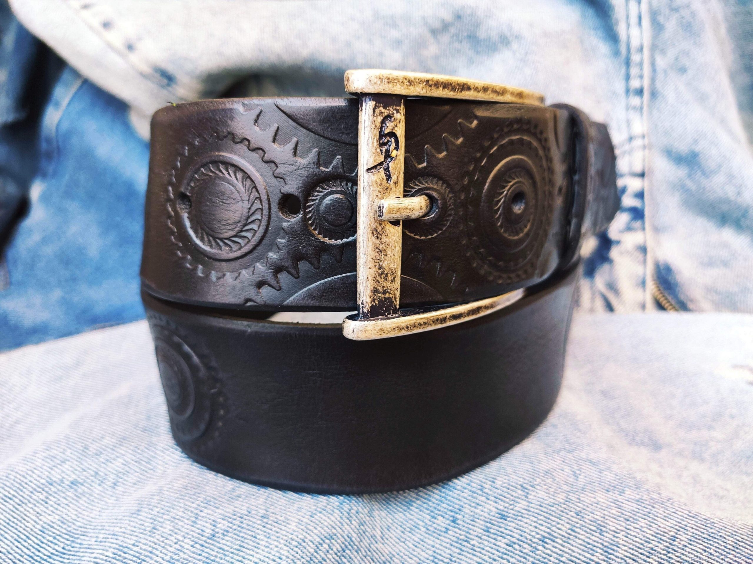 a handmade black leather belt embellished with stamps of motorcycle gear stunning belt for bikers the perfect gift for motorcycle lovers a handmade black leather belt embellished with stamps of motorcycle gear stunning belt for bikers the perfect gift for motorcycle lovers