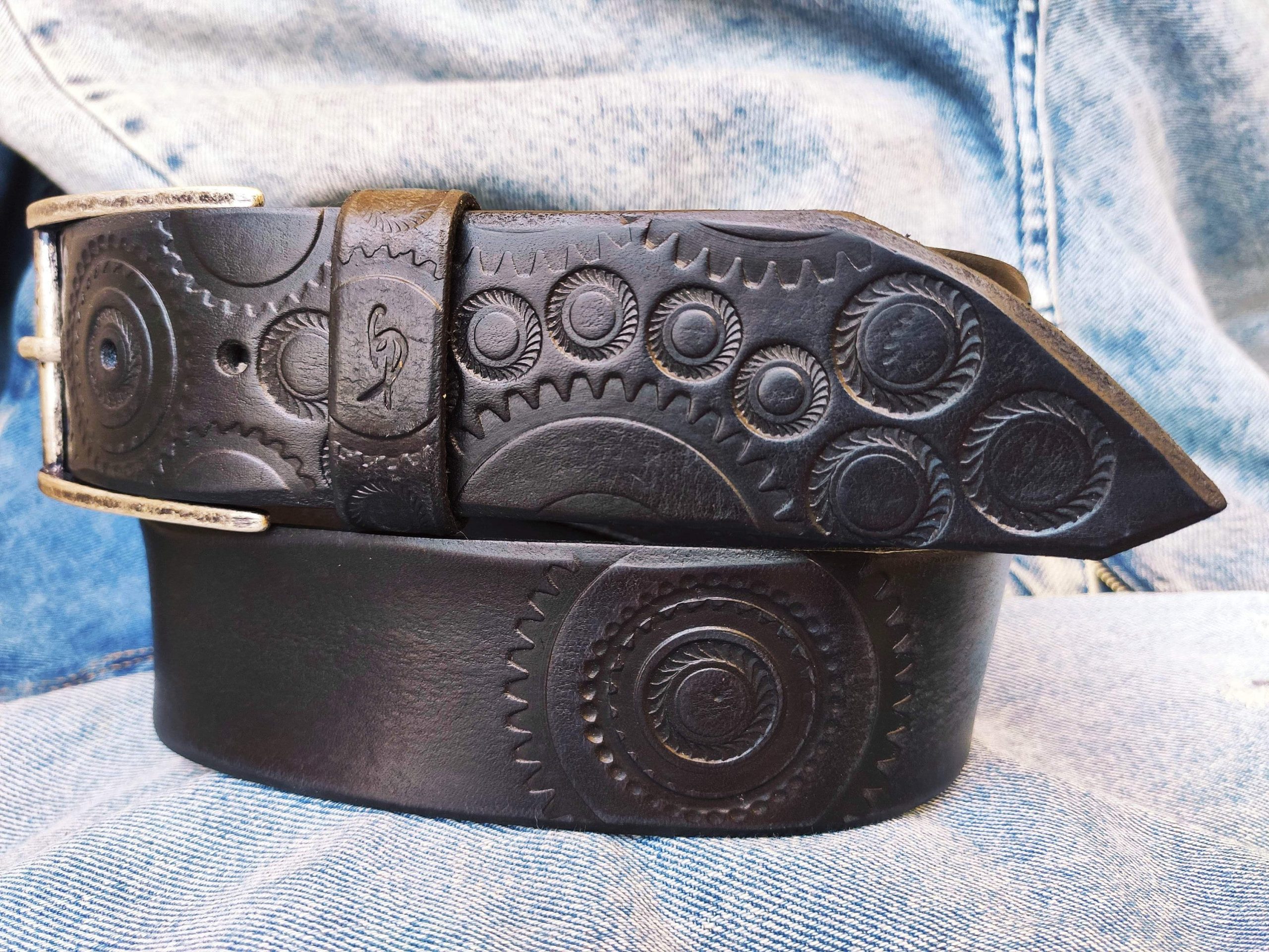 a handmade black leather belt embellished with stamps of motorcycle gear stunning belt for bikers the perfect gift for motorcycle lovers a handmade black leather belt embellished with stamps of motorcycle gear stunning belt for bikers the perfect gift for motorcycle lovers