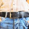 a handmade black leather belt embellished with stamps of motorcycle gear stunning belt for bikers the perfect gift for motorcycle lovers a handmade black leather belt embellished with stamps of motorcycle gear stunning belt for bikers the perfect gift for motorcycle lovers