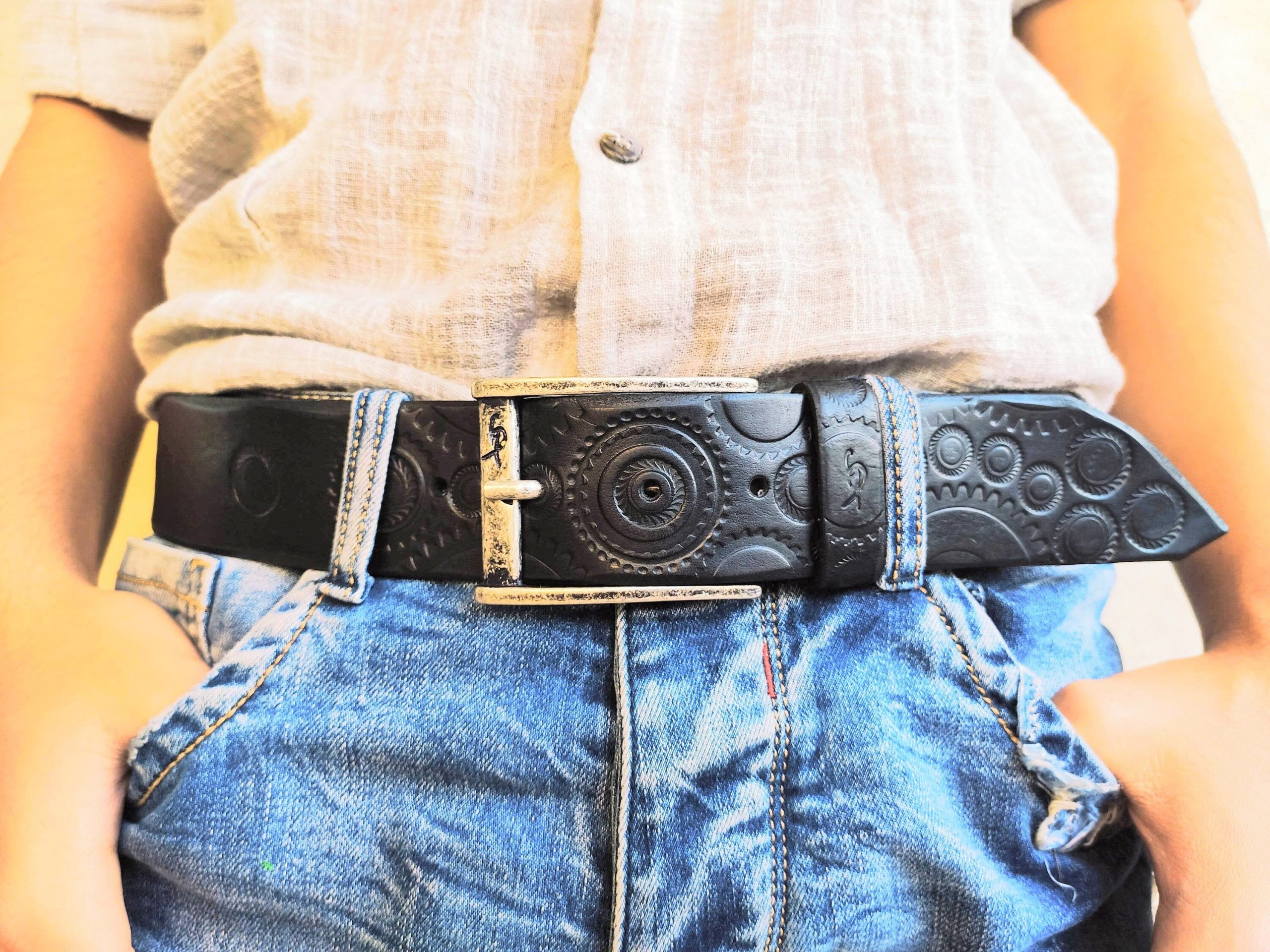 a handmade black leather belt embellished with stamps of motorcycle gear stunning belt for bikers the perfect gift for motorcycle lovers a handmade black leather belt embellished with stamps of motorcycle gear stunning belt for bikers the perfect gift for motorcycle lovers