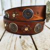 handcrafted brown leather belt with ishaor's unique design: light brown belt with gold and silver rivets and silver coin accents