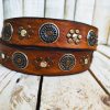 handcrafted brown leather belt with ishaor's unique design: light brown belt with gold and silver rivets and silver coin accents