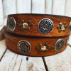 handcrafted brown leather belt with ishaor's unique design: light brown belt with gold and silver rivets and silver coin accents