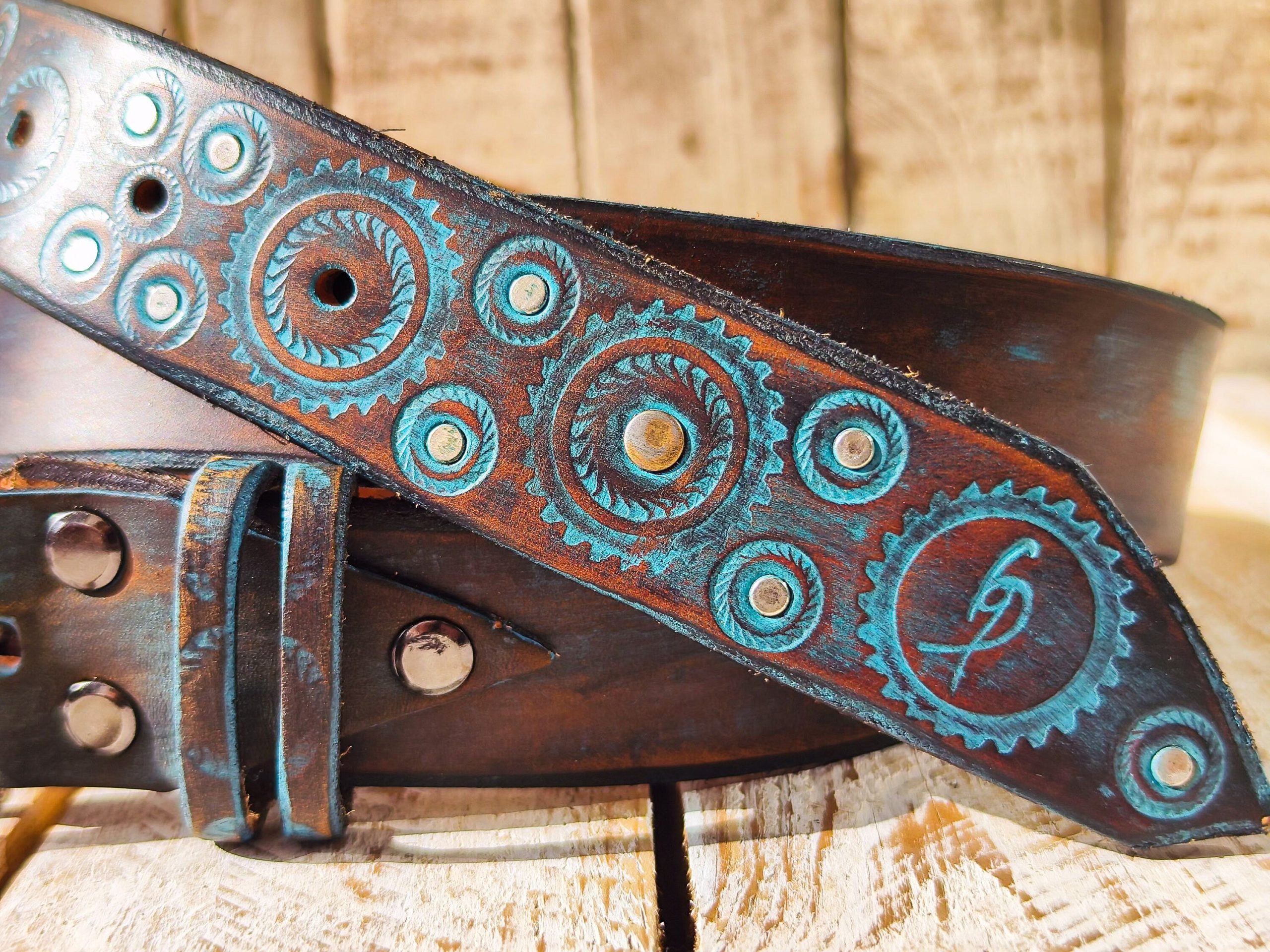 handmade brown leather belt with turquoise motorcycle gear design
