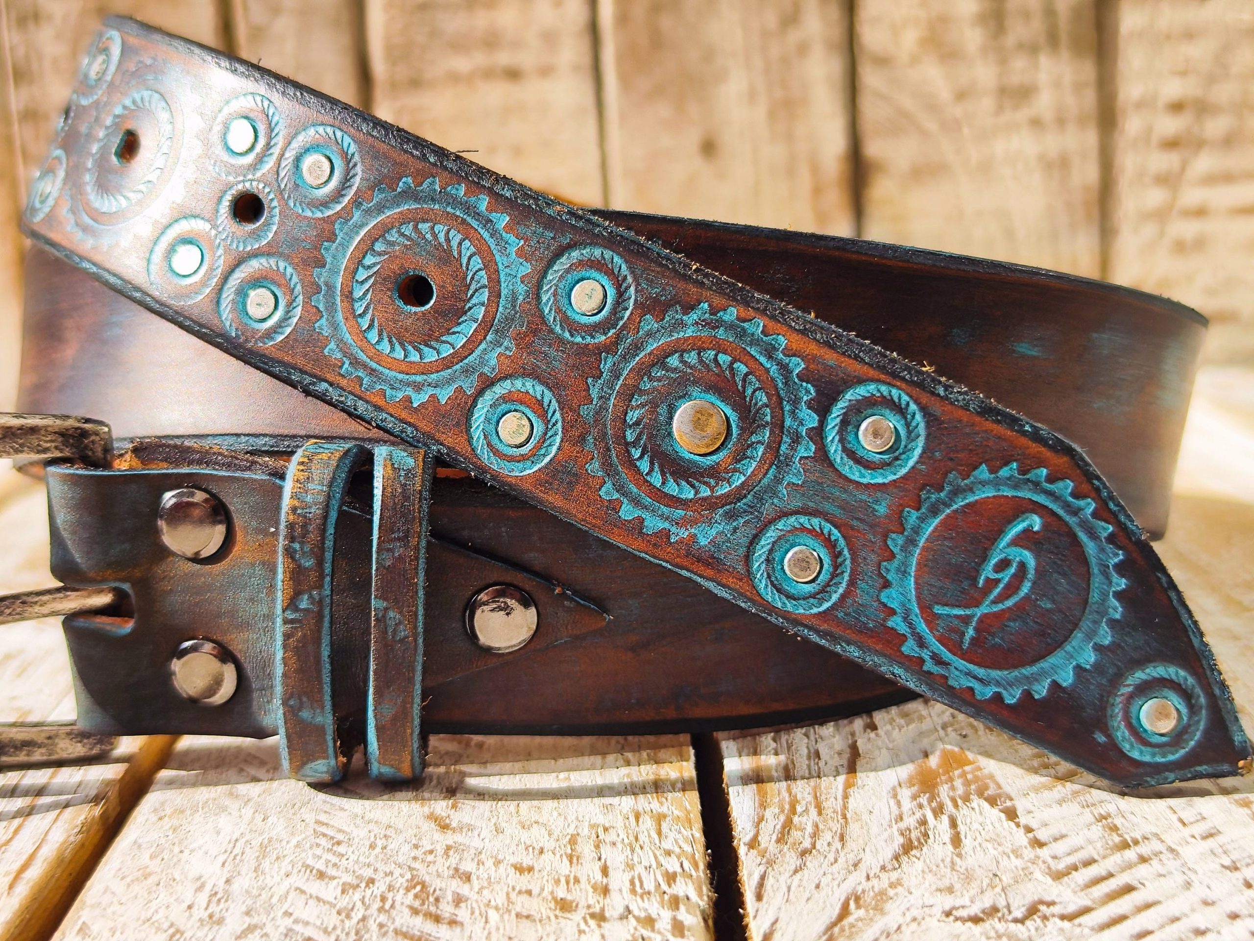 handmade brown leather belt with turquoise motorcycle gear design